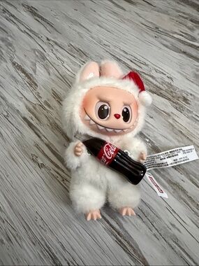 White Holiday Plush Labubu bag charm with Red Hat and Coca-Cola Bottle